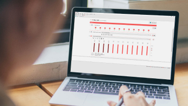 A laptop displays a screen in the MAESTRO 11 software where clinicians can complete a standard cochlear implant fitting procedure.
