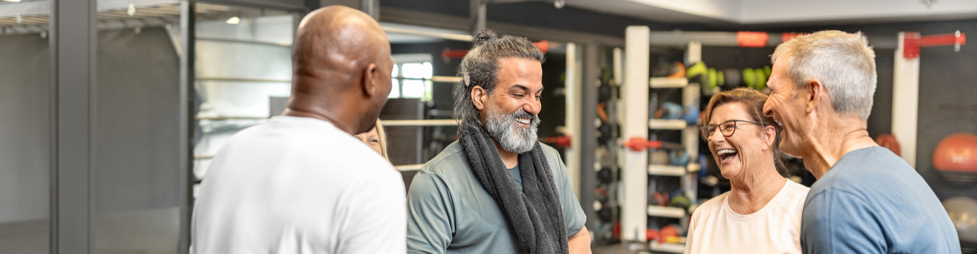 RONDO 3 user at the gym chatting with friends.