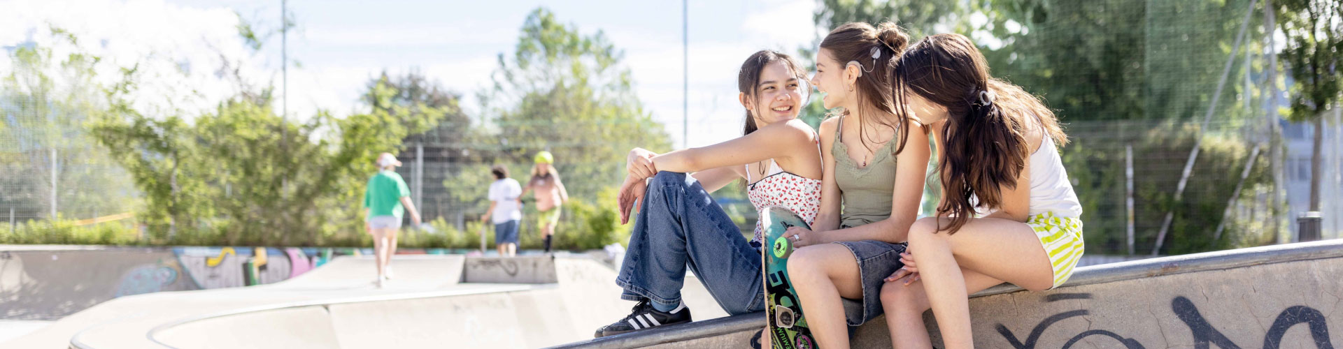 A Lifetime of Hearing three girls sitting at the skater park and having a chat